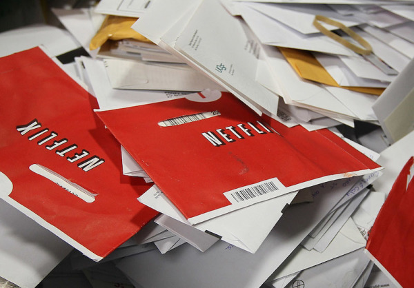 SAN FRANCISCO - MARCH 30: Red Netflix envelopes sit in a bin of mail at the U.S. Post Office sort center March 30, 2010 in San Francisco, California. If the U.S. Postal Service wins its bid to drop Saturday delivery service, customers of the popular online video rental company Netflix could see gaps in DVD delivery and will have to do without Saturday delivery, a popular day to receive movies. (Photo by Justin Sullivan/Getty Images)